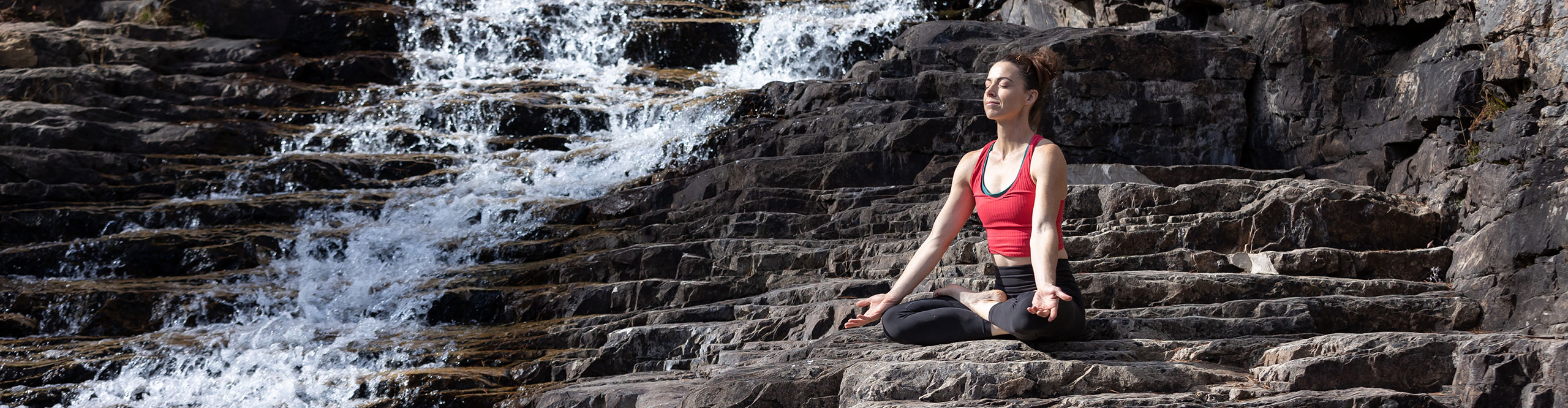 Holly Semanoff outdoors beside a stream